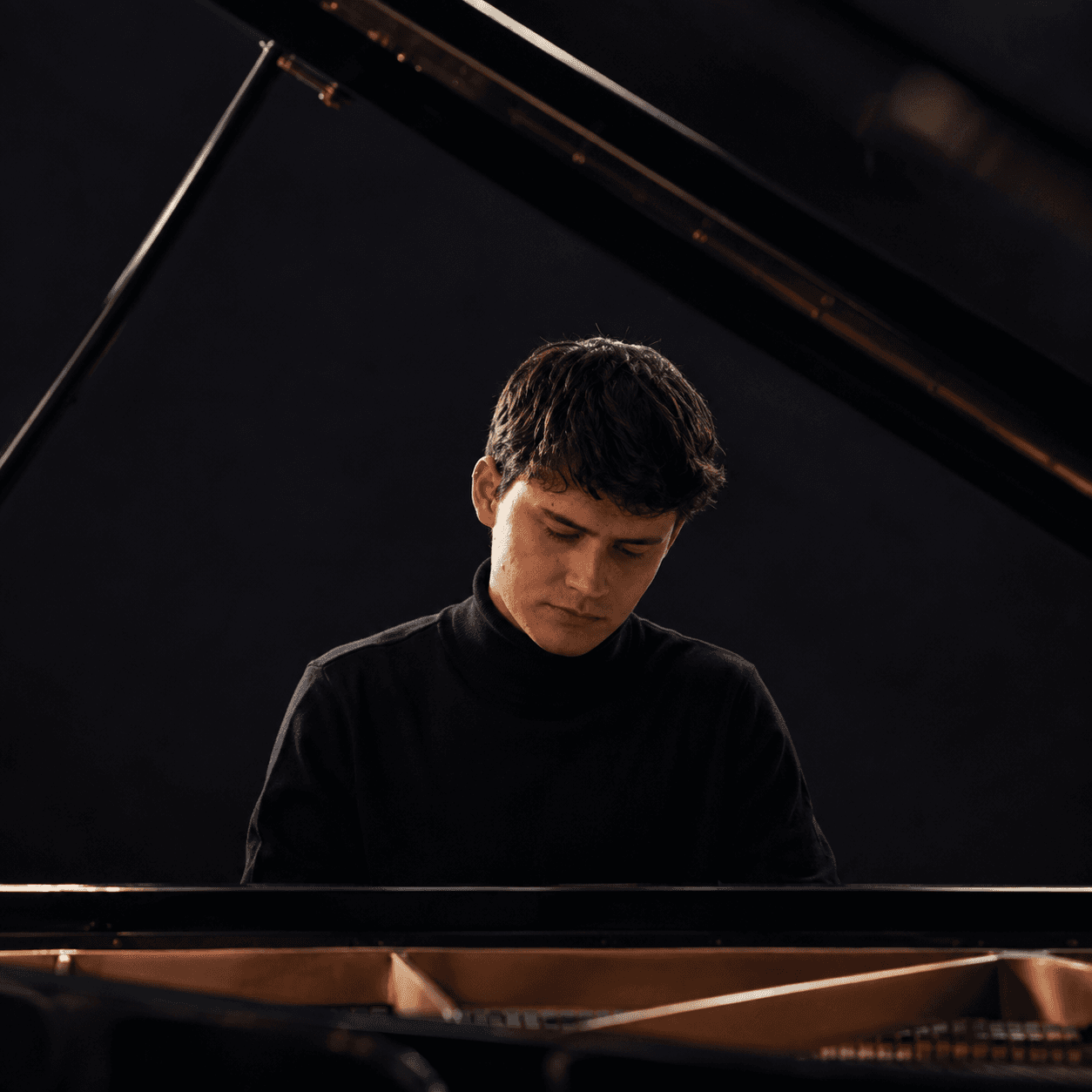 Santiago Agramont playing piano